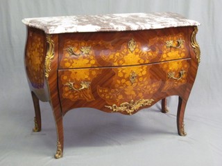 A 20th Century Kingwood commode of bombe shape with pink and white veined marble top, fitted 2 long drawers with gilt metal mounts and heavily inlaid throughout 42"