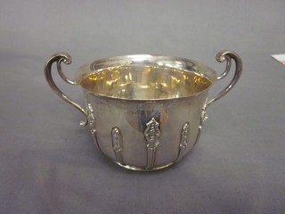 A silver twin handled bowl with cast decoration London 1908, 9 ozs