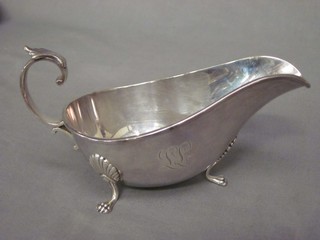 A Sterling sauce boat with C scroll handle raised on 3 hoof supports 4 ozs