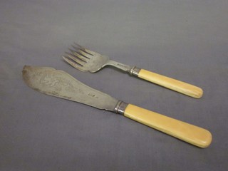 A pair of Edwardian engraved silver fish servers with ivory handles, Sheffield 1901 
