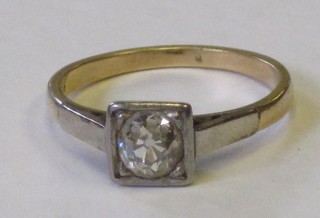 A lady's 18ct and white gold dress ring set a circular diamond