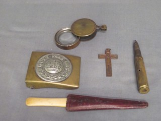 A Continental military belt buckle, a crucifix, a magnifying glass etc