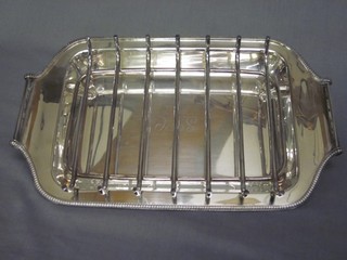 A silver plated twin handled asparagus dish together with a tray
