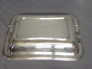 A silver plated entree dish and cover