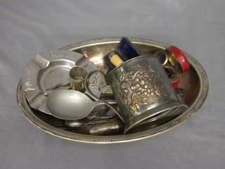 An oval silver plated entree dish lid, an embossed silver plated cup holder and various items of flatware, curios etc