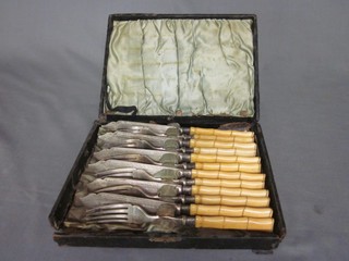 A set of 6 silver plated fish knives and forks silver bands and bone handles