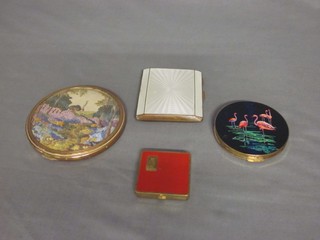 A Stratton compact decorated flamingos, an Art Deco gilt metal compact, a compact lid with embroidered decoration and 1 other