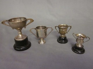 4 various silver twin handled trophy cups 3 ozs