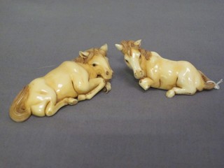 2 ivory Netsukes in the form of reclining horses (1 with hoof f) 3"