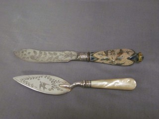 A Victorian silver plated butter knife with engraved blade and "Doulton" handle, together with a Victorian silver butter trowel with engraved blade and mother of pearl handle