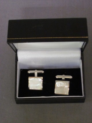 A pair of silver and mother of pearl cufflinks