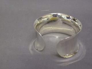 An unmarked silver bangle