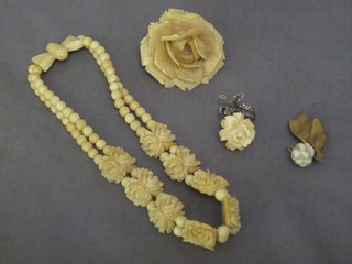 A carved ivory floral brooch together with an ivory bracelet