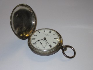 A silver pocket watch by Dent contained in a silver full hunter case