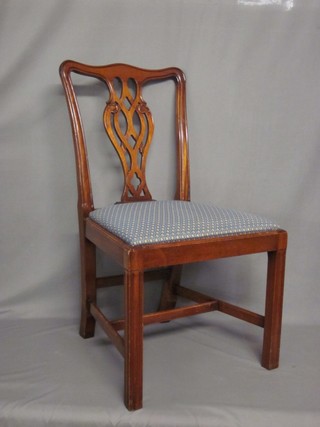 A pair of Chippendale style mahogany dining chairs with upholstered drop in seats, raised on square tapering supports with H framed stretcher