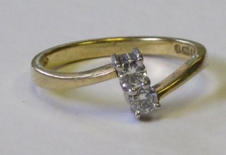 A lady's 18ct yellow gold dress ring set 2 diamonds