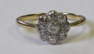 A lady's yellow gold cluster dress ring set diamonds