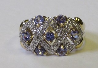 A lady's 18ct yellow gold dress ring set diamonds and tanzanite