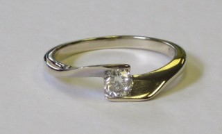 A lady's 18ct white gold solitaire dress ring set a diamond