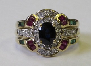 A lady's 9ct gold dress ring set rubies, emeralds and diamonds