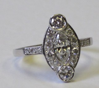 An 18ct white gold marquise shaped dress ring set numerous diamonds, approx 1.15ct