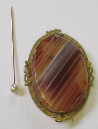 A Victorian oval agate brooch contained in a gilt metal mount together with a Tiffany pearl stick pin 
