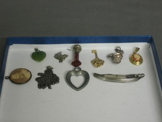 A small collection of costume jewellery including a seal and a 9ct key
