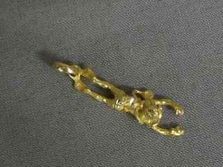 A Continental gold pendant in the form of a frogman
