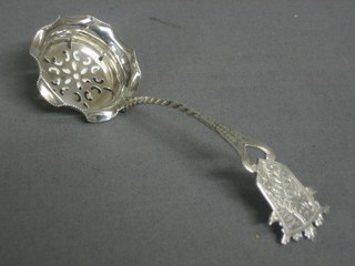 A silver sifter spoon