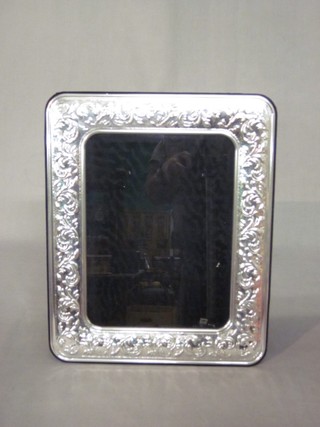 A modern silver easel photograph frame 13" x 10 1/2"