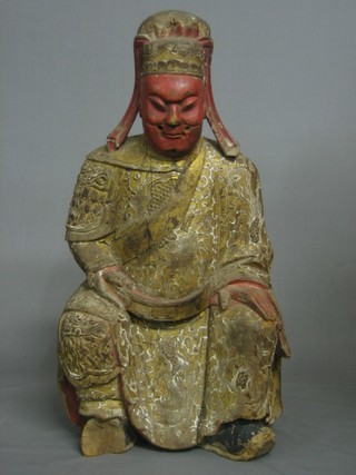 A 19th Century carved Eastern figure of a seated Deity 19" 