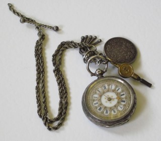 A lady's open faced fob watch contained in a Continental silver case hung on a Langtree watch chain