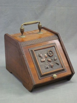 A Victorian carved walnut coal box