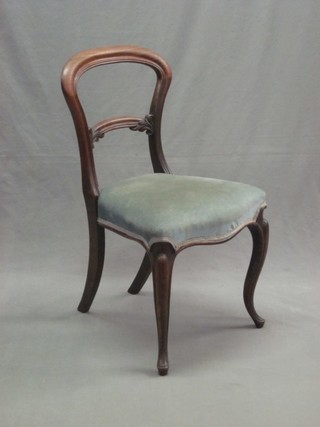 A Victorian mahogany balloon back dining chair with arched mid rail, raised on cabriole supports