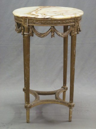 A 19th Century French circular gilt painted occasional table with onyx top and swag decoration, raised on turned and fluted supports 20"