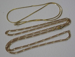 A gold flat link chain and a fine gold chain