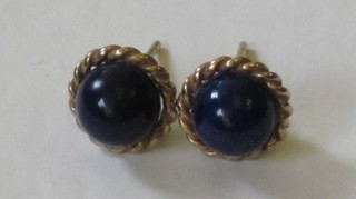 A pair of gold and lapis lazuli ear studs