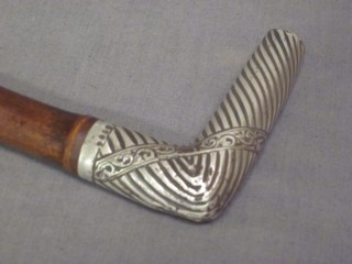A Victorian walking cane with silver handle