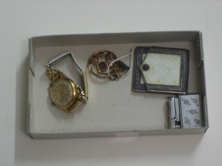 A gentleman's Orisa wristwatch, a gilt metal brooch, a small seal and an enamelled card case