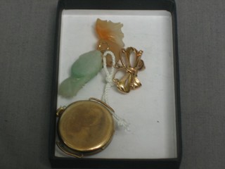A lady's gold cased wristwatch and 2 hardstone pendants in the form of fish
