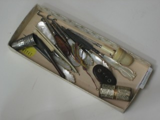 A collection of button hooks and other sewing related items