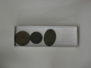 An oval William Brown South of England Music Hall 3D token, an 1811 London and Bristol half penny token, and an African? 1959 token