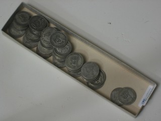 A collection of silver shilling pieces