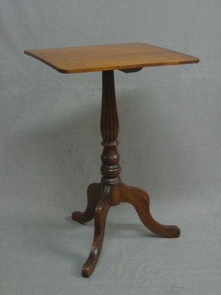 A 19th Century rectangular mahogany wine table raised on turned and reeded column tripod base 19"