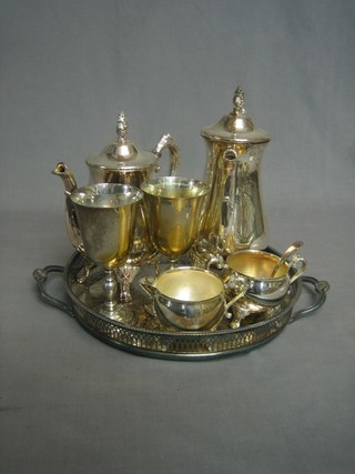 A silver plated 4 piece coffee service with coffee pot, hotwater jug, sugar bowl and cream jug together with a circular tray and 2 plated goblets