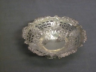 A circular pierced and embossed silver bowl