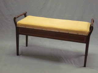 An Edwardian inlaid mahogany duet stool with hinged lid, raised on square tapering supports 38"