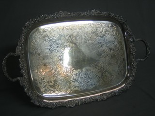 A rectangular engraved silver plated tea tray