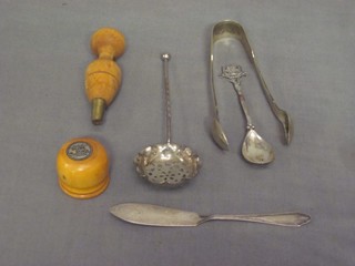 A silver plated teaspoon, a pair of tongs etc