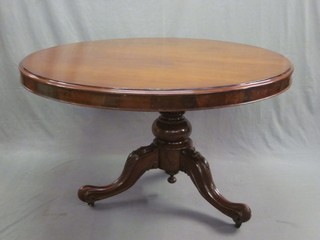 A Victorian circular mahogany snap top Loo table, raised on pillar and tripod supports 51"